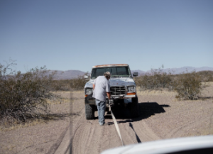 Bogged car on tow strap